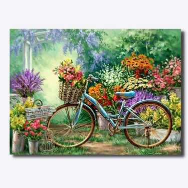 Diamond Painting jossa on polkpyora jonka korissa on vaaleanpunainen kukkakimppi ja taustalla erivarisia kukka asetelmia.